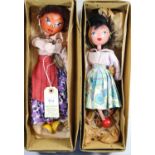 2 early Pelham Puppets. A Mexican style lady with white and purple flower style dress, deep pink