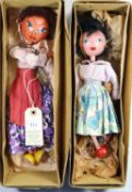 2 early Pelham Puppets. A Mexican style lady with white and purple flower style dress, deep pink