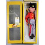 Pelham Puppet Soldier 'Fritzi'. In a scarlet jacket, with yellow buttons, grey trews with red stripe