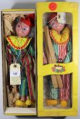 2 Pelham Puppet Clowns. Both similar examples, but with differences. One with two tone green, pink/