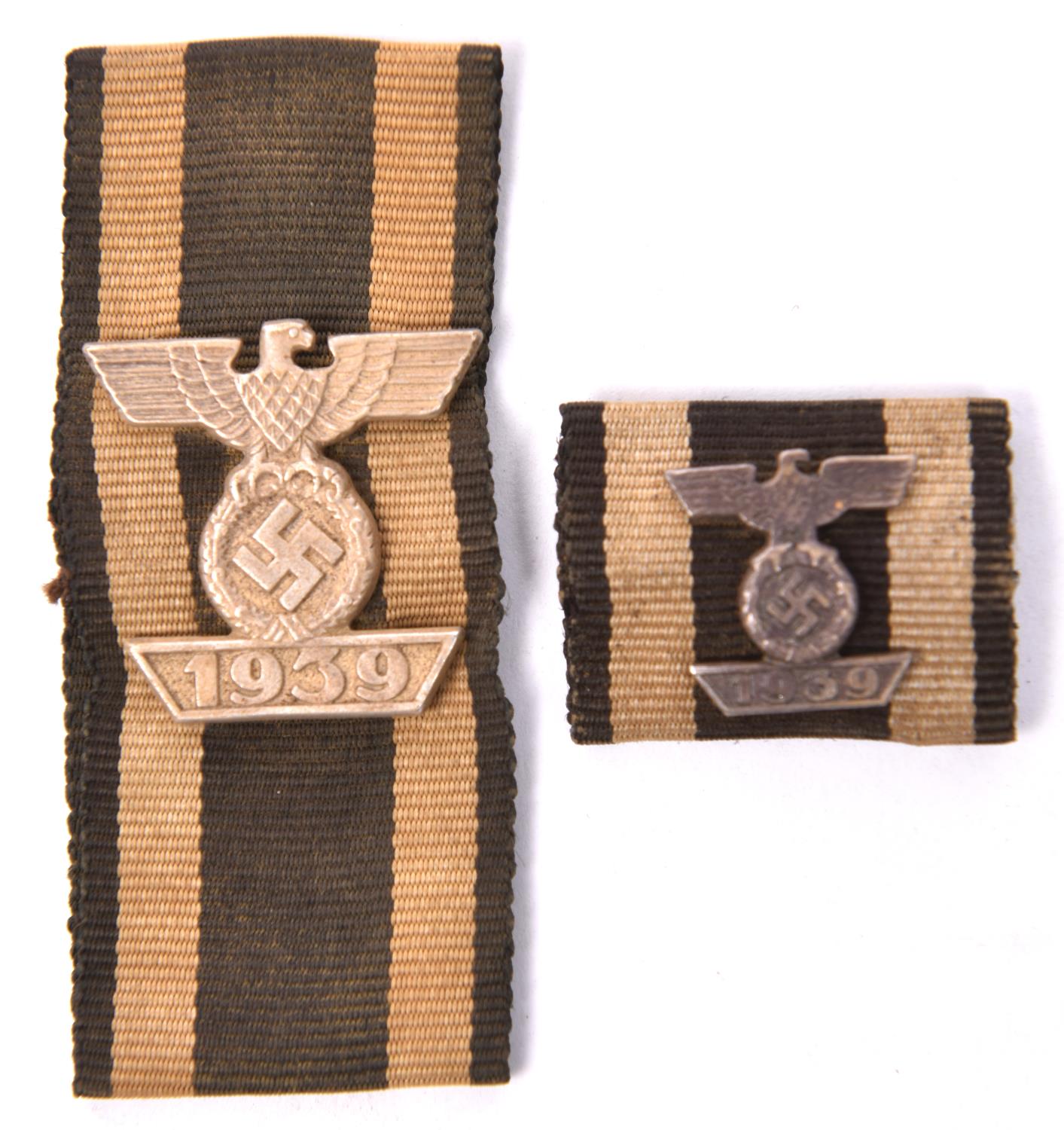 A 1939 bar to the 1914 Iron Cross 2nd class, mounted on a length of very faded ribbon; and a similar