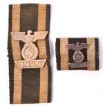 A 1939 bar to the 1914 Iron Cross 2nd class, mounted on a length of very faded ribbon; and a similar