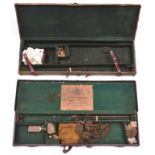 A leather bound canvas covered green baize lined case for a gun with 2 sets of 30” barrels, 31” x 9”