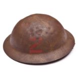 A WWI raw edge Brodie’s pattern steel helmet, red painted black letter “Z” (Channel Islands “),