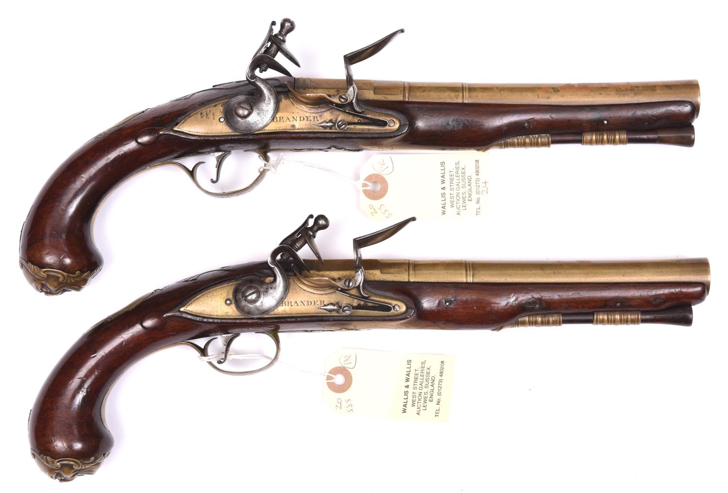 A pair of 18 bore brass barrelled flintlock holster pistols by Brander, c 1760, 13½” overall, 3