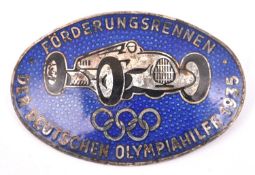 A Third Reich oval silver plated and blue enamel pin back badge, depicting an Auto Union racing