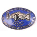 A Third Reich oval silver plated and blue enamel pin back badge, depicting an Auto Union racing