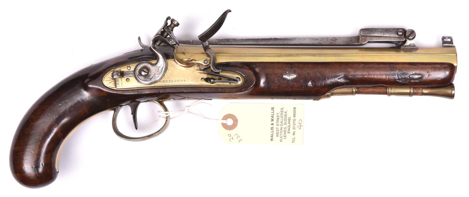 A 28 bore brass barrelled flintlock pistol with spring bayonet, by W Ketland & Co, C 1820, 14½”