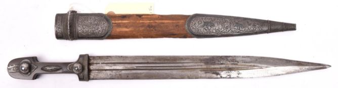 A 19th century kindjal, triple fullered blade 13½”, darkened horn grips, wtih engraved Eastern