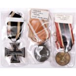 3 German medals: 1914 Iron Cross 2nd class; Third Reich West Wall medal; and War Merit medal, all