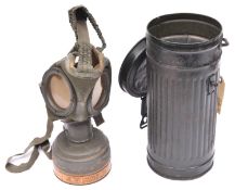 A Third Reich civilian Luftschutz gas mask, the filter with waffenamt stamp, date 1940, and with