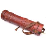 A WWI period canvas covered shell bucket, painted red overall, with R Arms (faint) and other