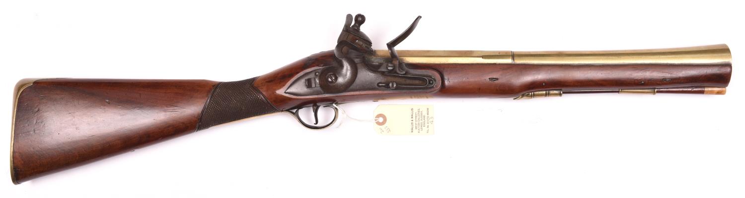 A heavy brass barrelled flintlock blunderbuss of military appearance, 32” overall, unmarked slightly