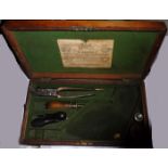 A green baize lined fitted oak case for an Adams percussion revolver, with trade label of R Adams,
