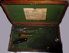A green baize lined fitted oak case for an Adams percussion revolver, with trade label of R Adams,