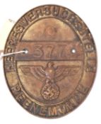 A Third Reich oval cast brass plaque, inscribed around the rim “Heeresversuchsstelle Peenemunde”,