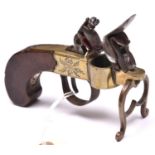 An early 19th century flintlock tinderlighter, in the form of a brass framed pocket pistol, frame