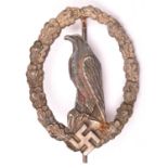 A Third Reich Former Pilot’s Commemorative badge, silver washed with grey eagle and round pin. GC