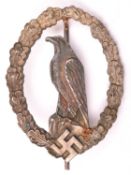 A Third Reich Former Pilot’s Commemorative badge, silver washed with grey eagle and round pin. GC