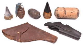 A dummy American “pineapple” grenade; 2 WWII shell fuses (one fired, one unused); a flap top leather