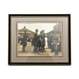 An early 19th century signed photograph of F. Marshal Lord Kitchener, wearing peaked cap and frock