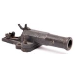 A French 16 bore pinfire cast iron alarm gun, half octagonal barrel 4¾”, on its base with two