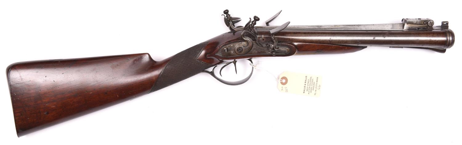 A rare early 19th century double barrelled flintlock blunderbuss with spring bayonet, by Jackson,