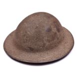 A WWI Brodie’s pattern steel helmet, rough sanded finish, leather chinstrap with owner’s no and