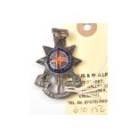 An Officer’s enamelled silver cap badge of The R Sussex Regt, HM JRG & Co B’ham 1932, brooch pin;