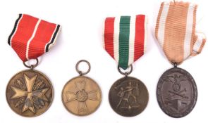 Third Reich medals: bronze Medal of Merit without swords; Return of Memel; West Wall; and War