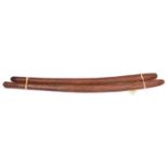 2 Australian Aboriginal hardwood throwing sticks, of slightly curved form, lightly carved with