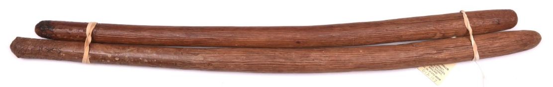 2 Australian Aboriginal hardwood throwing sticks, of slightly curved form, lightly carved with