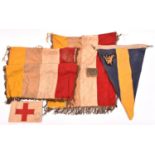 A WWI Army Medical Service arm band, red cloth on white linen with circular AMS stamp, and inside “