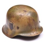A Third Reich M42 steel helmet, with camouflage finish, the single decal removed, maker’s mark “