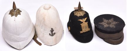 A US military cadet’s blue cloth spiked helmet, brass top mount and spike, HP with “10” in shield