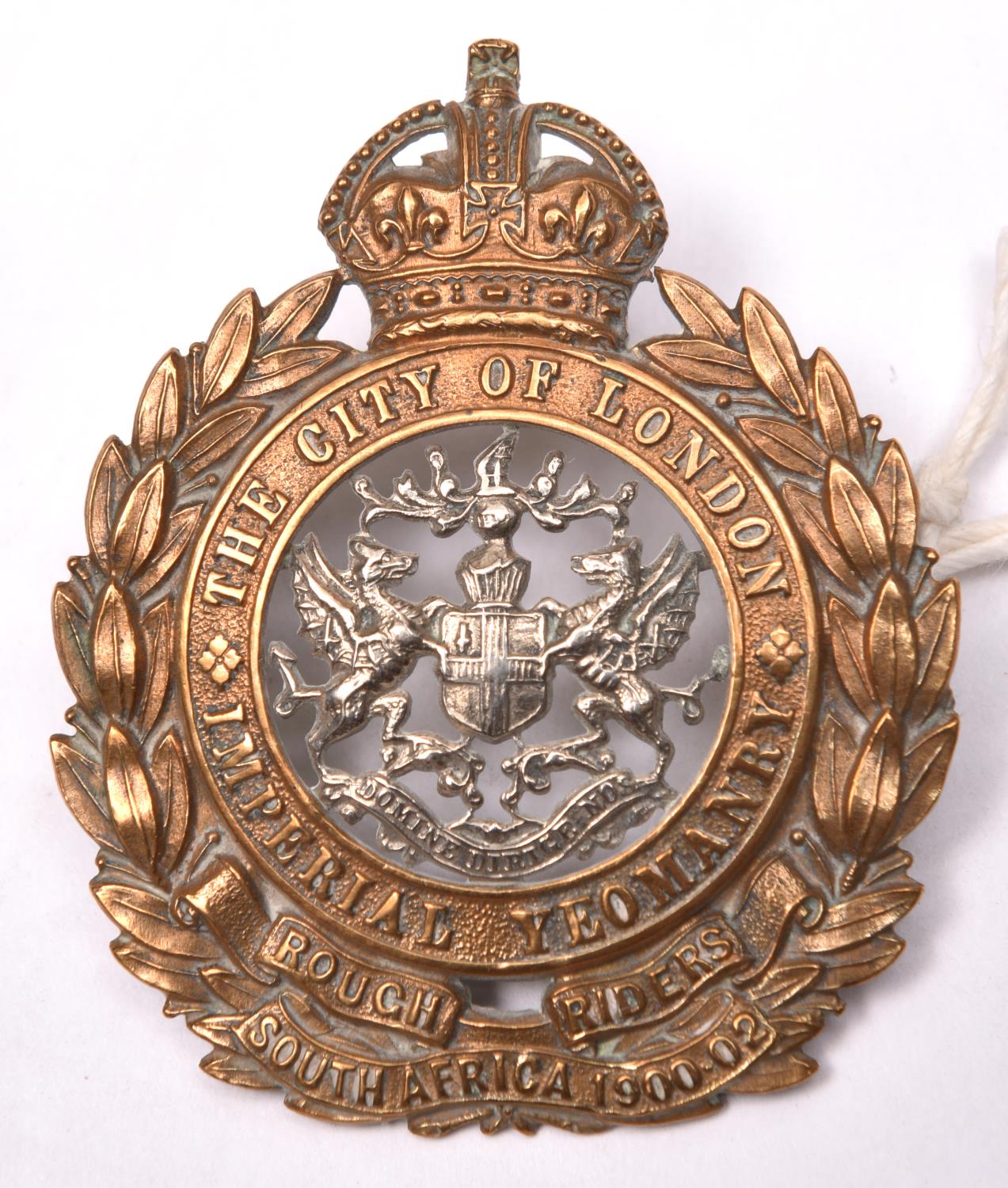 An OR’s bimetal cap badge of the City of London Imperial Yeomanry, GC (centre backing plate missing)