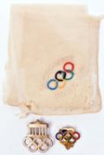 A German small gilt and white enamel pin back badge for the 1936 Berlin Olympics, the back marked “