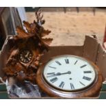 2 clocks. An early 20th century English round dial timepiece in a mahogany case. Together with a