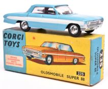 Corgi Toys Oldsmobile Super 88 (235). An example in light blue with white flash and red interior,