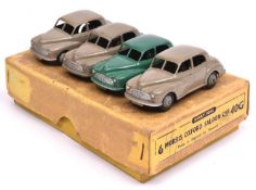 A Dinky Toys Trade Box for 6 Morris Oxford Saloon Car (40G). Containing 4 examples, one in dark