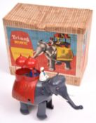 A scarce Tri-ang Minic clockwork Elephant and Howdah. A plastic elephant with driver and passenger