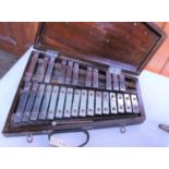 A glockenspiel in a substantial wooden case. Made by Mayers & Sons, Manchester with thick chrome