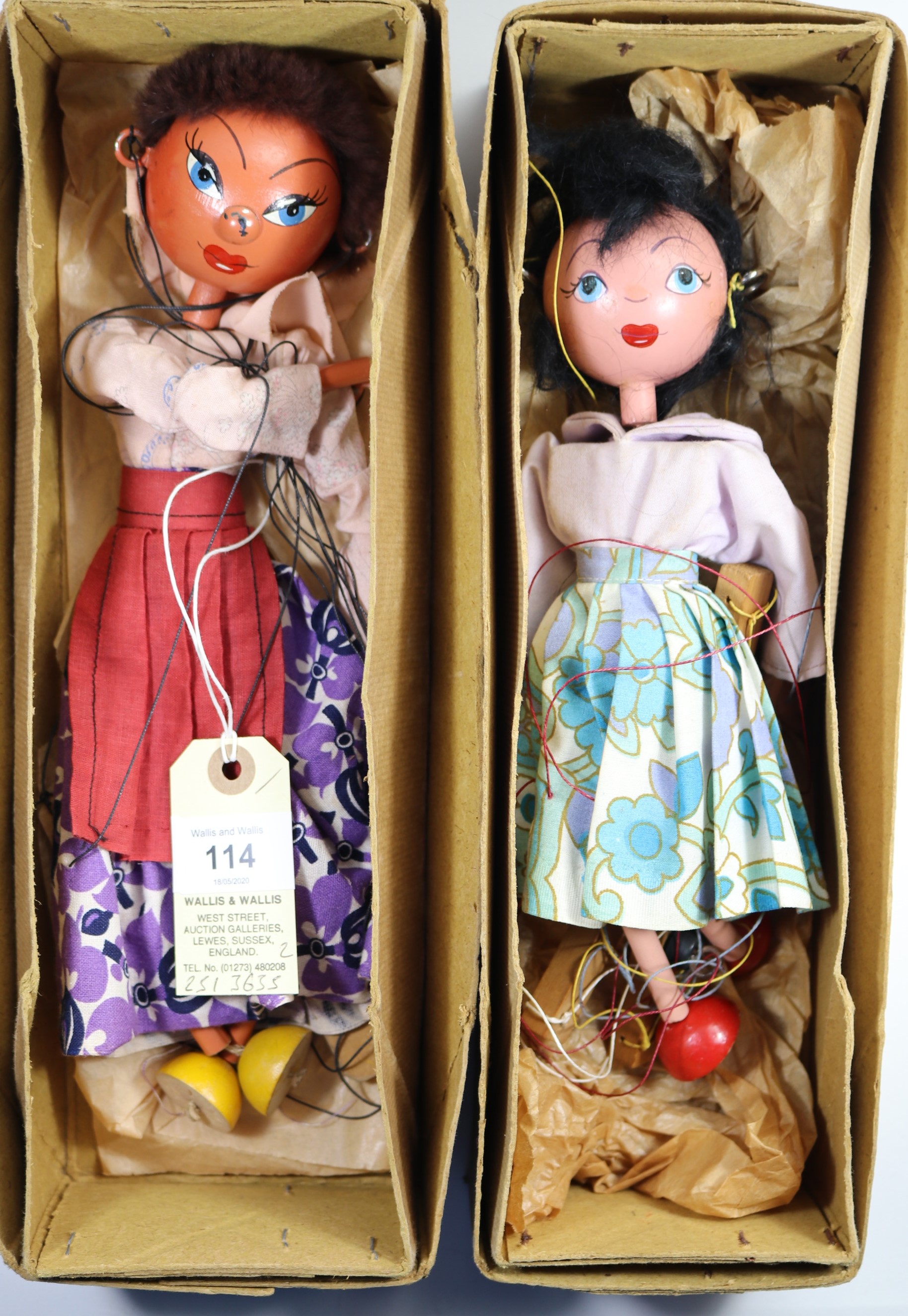 2 early Pelham Puppets. A Mexican style lady with white and purple flower style dress, deep pink
