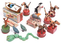 13x Tri-ang Minic novelty toys. Including; a boxed plastic clockwork 'Jack in a Boat' (3093)