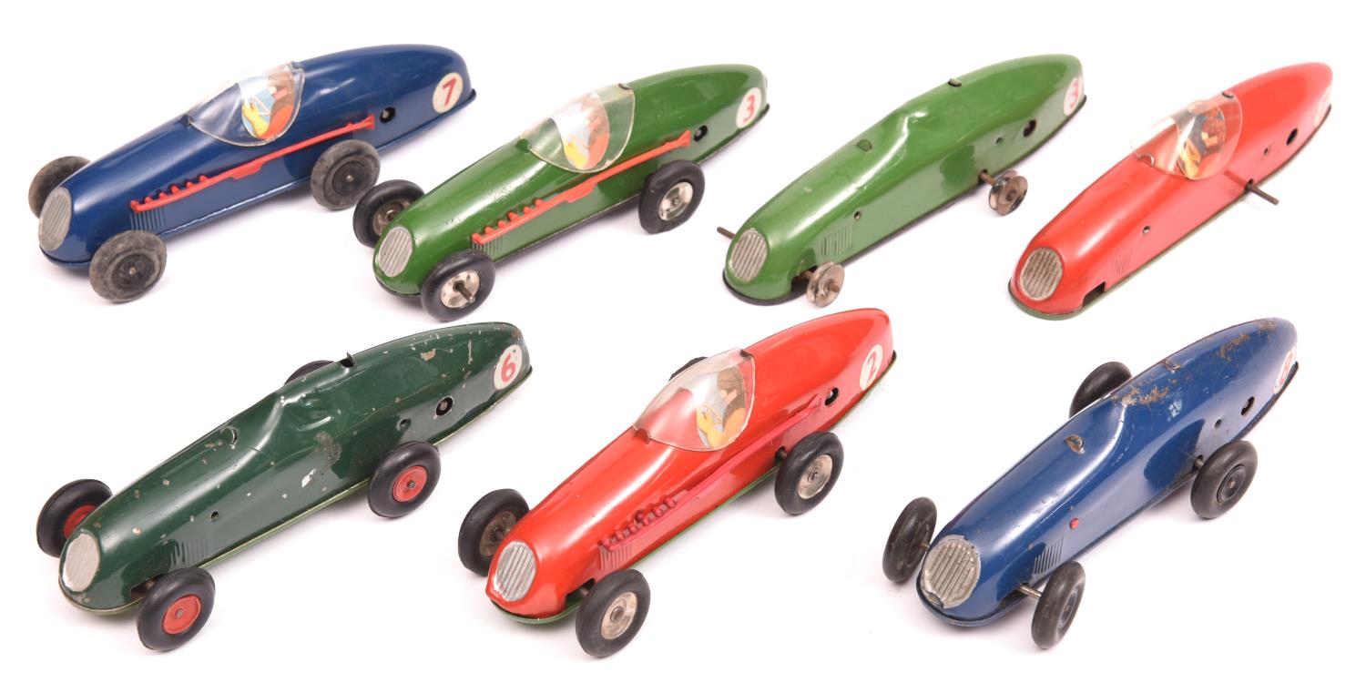 7x Tri-ang Minic clockwork Racing Cars (13M). All post-war examples; 2x red - RN2 & RN7, 2x