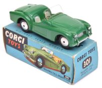 Corgi Toys Triumph TR2 Sports Car (301). Example in dark green with cream seats, smooth spun