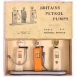 A scarce Britains Petrol Pumps set 101V. 3-pump set; Shell, B.P. and National Benzole. On a grey