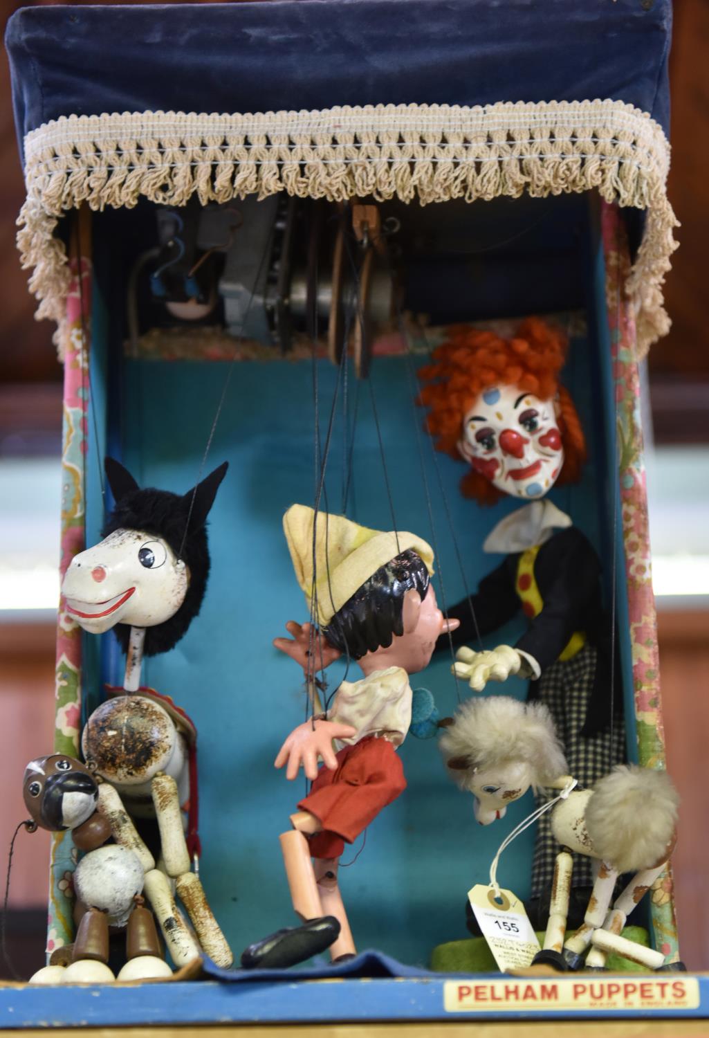 A 1970s Pelham Puppets small shop display unit. Featuring a clown, Pinocchio, a horse, a pony and