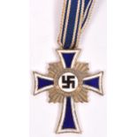 A Third Reich Mother's Cross, appears to have originally been gold, the back retaining gold