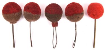 5 woollen ball plumes for 19th century shakos, comprising 4 dark red over grey and one small